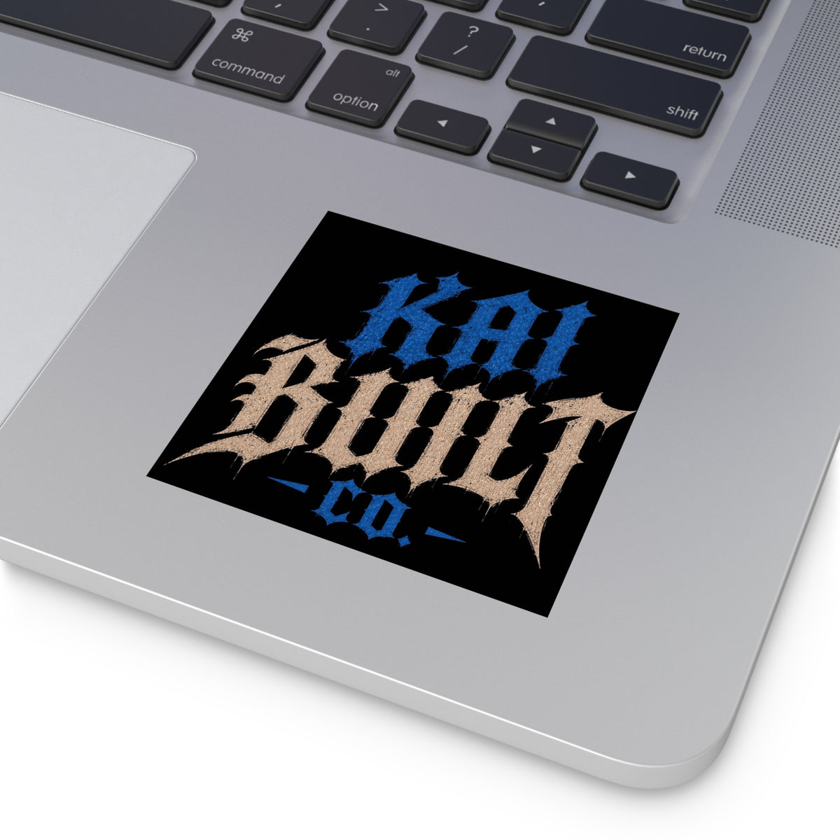 Kai Built Co logo sticker applied to laptop